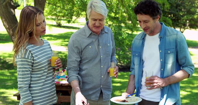 Family Grilling Outdoors on a Sunny Day with Refreshments - Download Free Stock Images Pikwizard.com