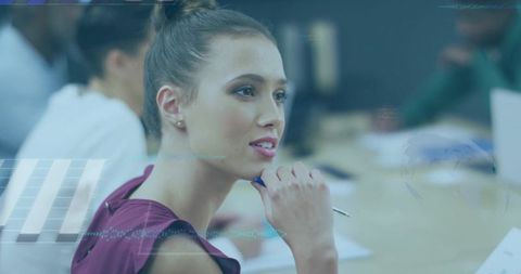 Young professional woman listening at collaborative meeting with digital overlays