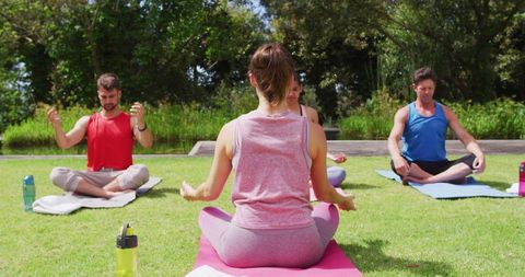 Outdoor Yoga Class with Diverse Group in Park Setting