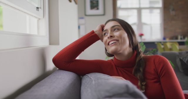 Happy Woman Relaxing on Couch Looking Out Window - Download Free Stock Images Pikwizard.com