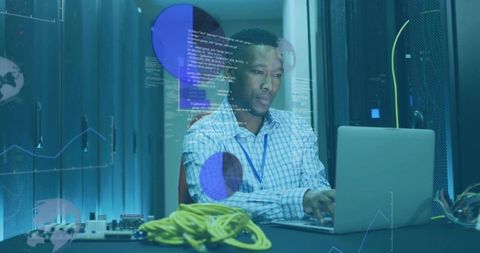 It technician working on laptop in server room with network cables and data overlays