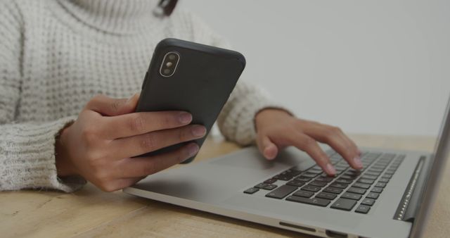 Person Working on Laptop and Checking Smartphone - Download Free Stock Images Pikwizard.com