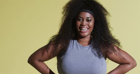 Confident African American Woman Smiling in Studio with Headband