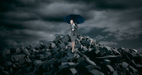 Businesswoman with Umbrella Standing on Rubble Facing Stormy Sky - Download Free Stock Images Pikwizard.com
