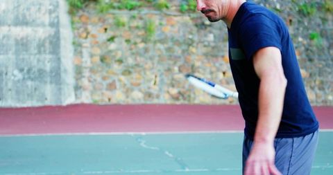 Mature man swinging tennis racket practicing with social media subscribe and like notifications
