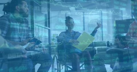 Diverse business team in wheelchair collaborating on financial data