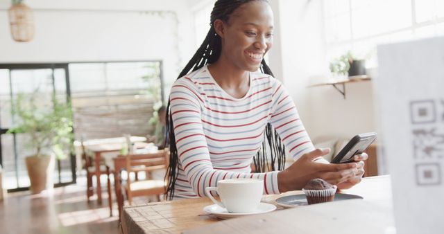 Smiling Woman Using Smartphone in Cozy Coffee Shop - Download Free Stock Images Pikwizard.com