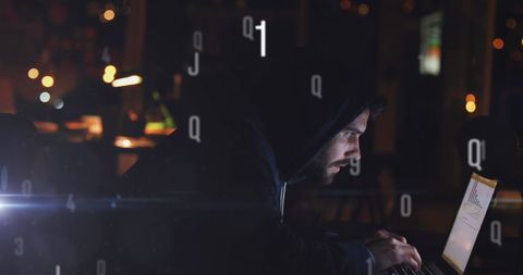Focused Man in Hoodie Working Late Night on Laptop - Download Free Stock Images Pikwizard.com
