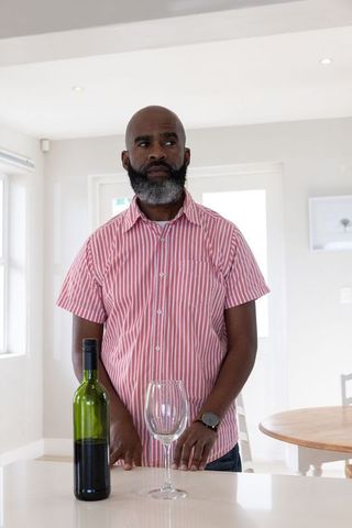 Man Enjoying Wine Moment at Modern Home