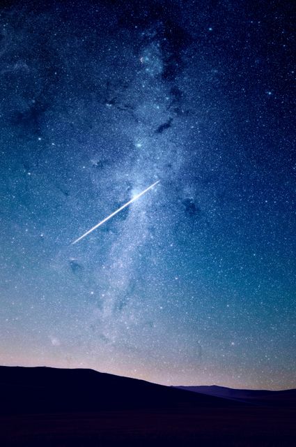 Bright Meteor in a Starry Sky Over a Dark Horizon - Download Free Stock Photos Pikwizard.com