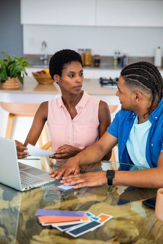 Couple Collaborating on Design Project in Modern Kitchen