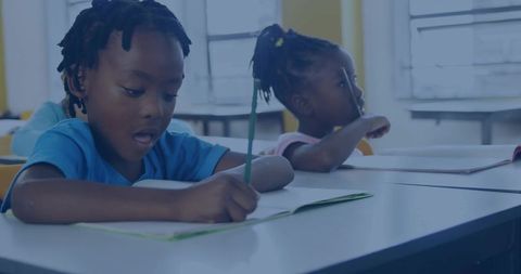 Young Students Writing in Classroom Stressed on Education