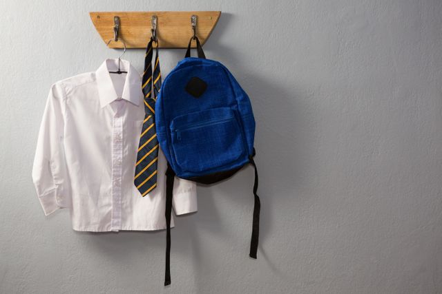School uniform and schoolbag hanging on hook - Download Free Stock Photos Pikwizard.com