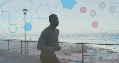Fit Man Jogging along Beach with Medical Graphics Overlay