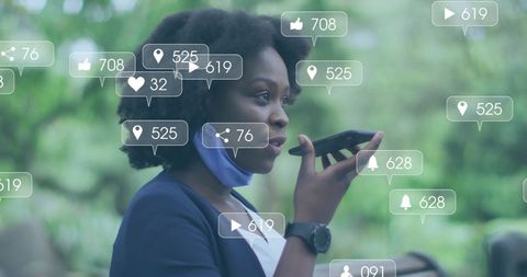 African American Woman Engaging in Social Media Interaction Outdoors