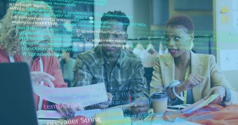 Business Team Collaborating on Data with Laptop and Charts