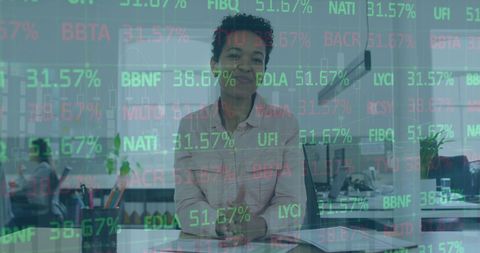 Financial Analyst Reviewing Stock Market Trends in Office