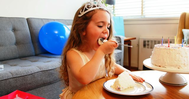Cute girl having cake at home