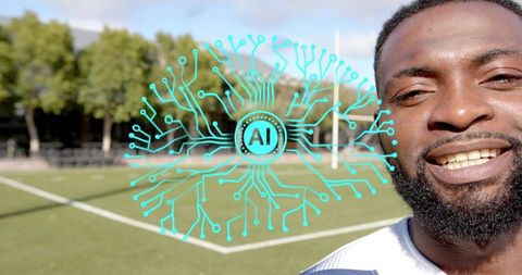Smiling football player showcasing AI circuit overlay on outdoor turf field with goalpost