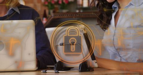 Cyber Security Icon Hovering Over Tablets in Modern Coffee Shop - Download Free Stock Images Pikwizard.com