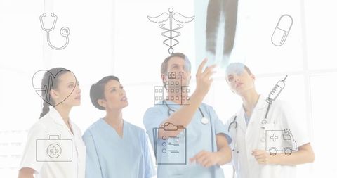 Medical team reviewing x-ray, doctor pointing, leading clinical collaboration in hospital