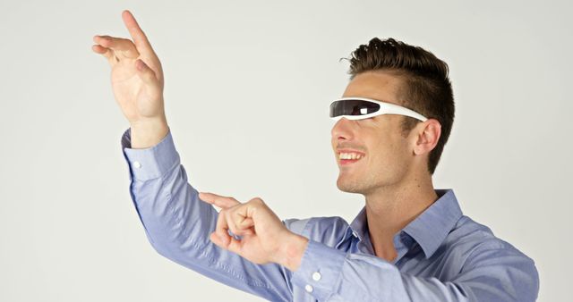 Man using augmented reality glasses with gestural interface in modern technology concept - Download Free Stock Images Pikwizard.com
