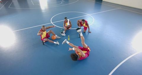 Young Basketball Players Enjoying Break on Court