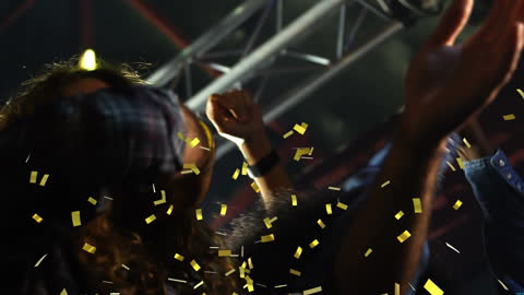 People Celebrating with Falling Confetti at Party
