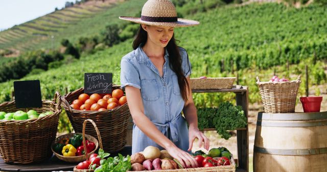 A young woman with a hat setting up a display of fresh vegetables and fruits at an outdoor farmer's market. Perfect for illustrating scenes of sustainable living, agriculture, local farming, and the farm-to-table movement. Ideal for promoting organic food, health, gardening, outdoor lifestyle, and community events.