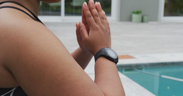 Person Meditating by Pool with Fitness Tracker - Download Free Stock Images Pikwizard.com