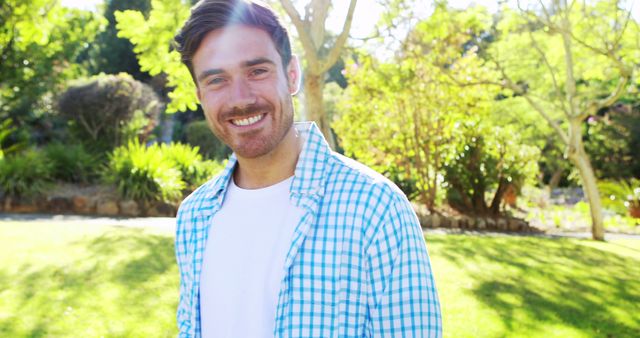 Smiling Man Enjoying Sunny Day in Park - Download Free Stock Images Pikwizard.com