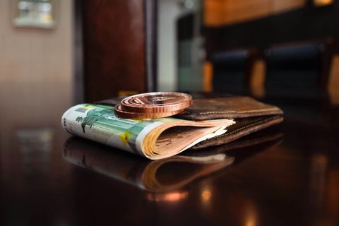 Euro Notes and Coins on Wallet Symbolizing Financial Planning