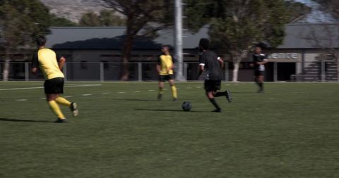 Youth soccer players training outdoor for team fitness and skill development