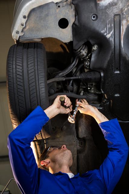 Mechanic servicing a car at repair garage