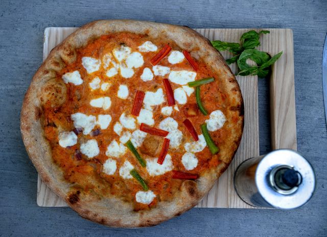 Perfect for food blogs, Italian cuisine promotions, restaurant menus, or culinary magazines. Showcases classic Margherita pizza with a delicious cheese topping, ideal for gourmet and home dining features.