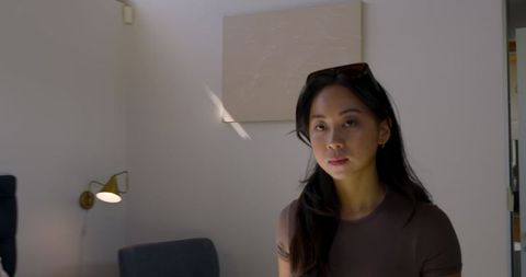 Woman in modern lounge with minimalist decor