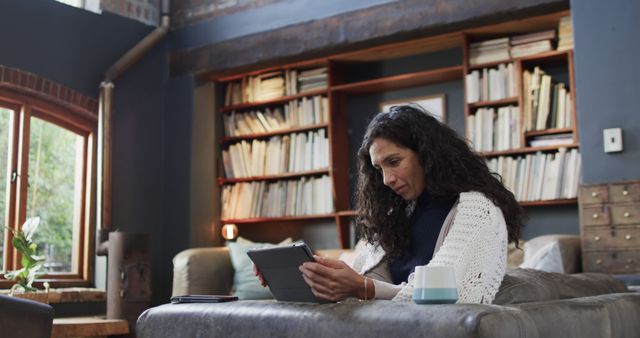 Middle-Aged Woman Reading Digital Book Tablet Home Library - Download Free Stock Images Pikwizard.com