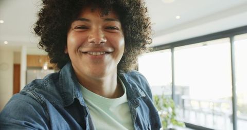 Cheerful African American Man Smiling at Home in Casual Attire