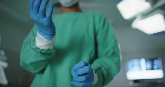 Surgeon Preparing for Surgery in Operating Room with Protective Gear - Download Free Stock Images Pikwizard.com