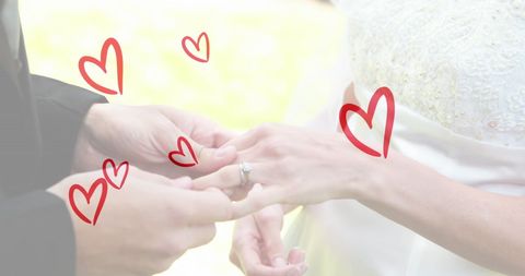 Romantic Couples Hands Exchanging Rings with Floating Red Hearts