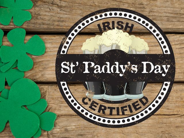 Badge reading 'St Paddy's Day Irish Certified' placed on rustic wooden background with surrounding green shamrock decorations. Perfect for advertisements promoting St. Patrick's Day events, themed parties, Irish heritage celebrations, promotional material for bars or pubs, and social media posts invoking festive atmosphere.