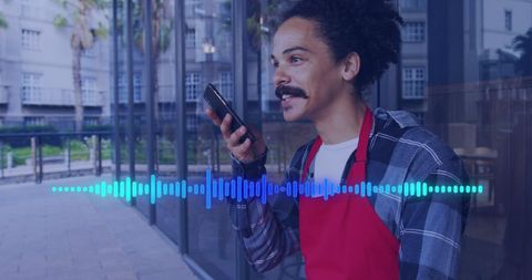 Man Utilizing Smartphone in Urban Setting with Data Overlay