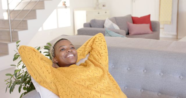 Happy Woman Relaxing on Sofa in Cozy Living Room - Download Free Stock Images Pikwizard.com