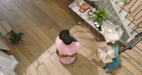 Friends embracing during exciting new home move