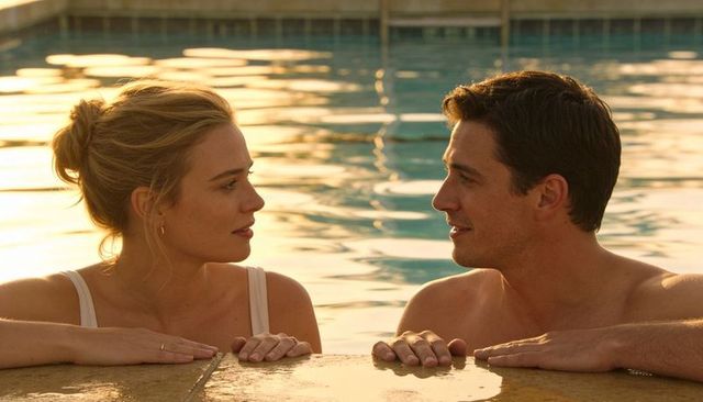 Sunlit couple leaning at pool edge sharing romantic evening conversation