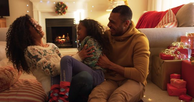 Happy Family Celebrating Christmas by Fireplace at Home - Download Free Stock Images Pikwizard.com