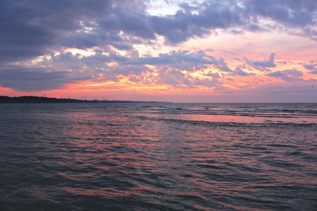 Serene Sunset Over Calm Sea With Beautiful Clouds - Download Free Stock Photos Pikwizard.com