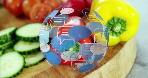 Showing vibrant vegetable chat overlay: cucumbers, tomatoes, bell pepper on cutting board