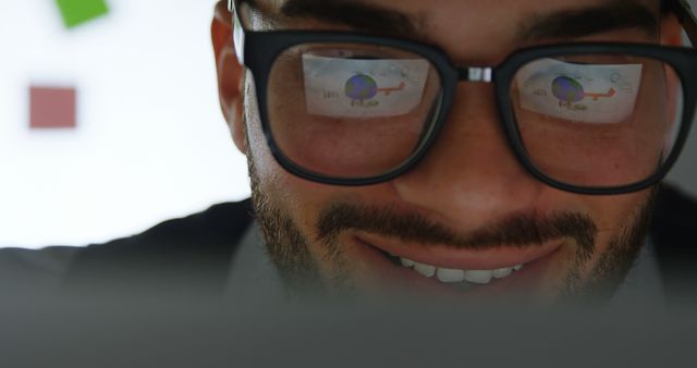 Businessman Analyzing Data on Computer Screen with Glasses Reflection - Download Free Stock Photos Pikwizard.com