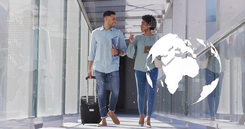 Two Busy Colleagues Collaborating in Airport Passage